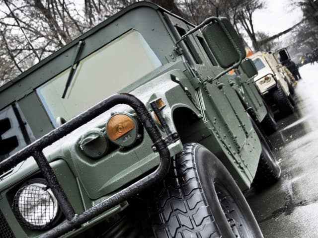 Service member in front of a sunset background operating drone  that has undergone military and aerospace component certification
