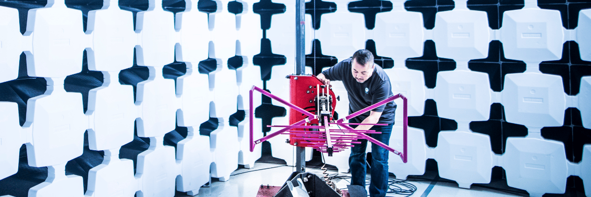 Element test engineer setting up equipment in RF testing chamber